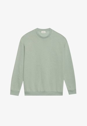 Sweatshirt à col rond, manches longues, de couleur vert clair, avec des poignets et un ourlet côtelés, présenté à plat sur un fond blanc.