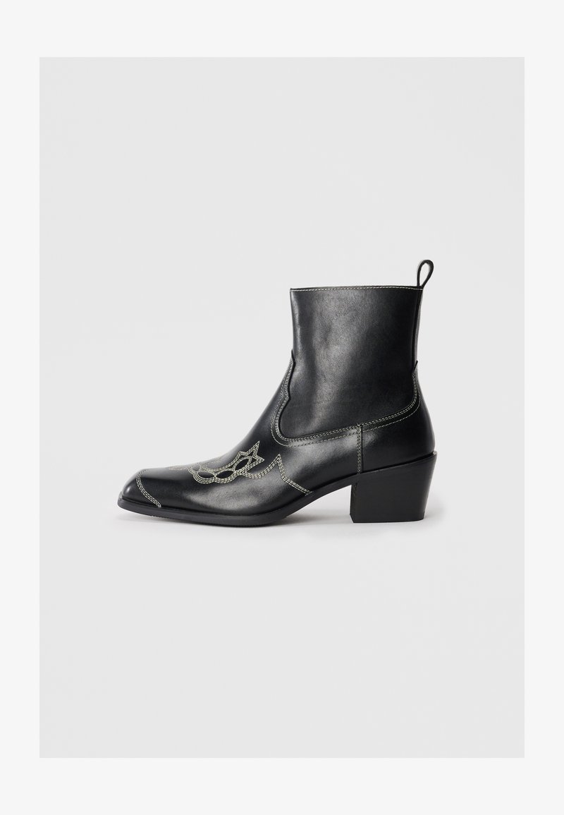 Black leather ankle boots with a square toe, decorative stitching, and a low block heel. Features a pull tab for easy wear.