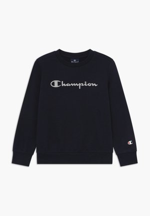 Felpa blu navy in cotone, con un grande logo "Champion" ricamato sul petto e un piccolo logo sul manico.