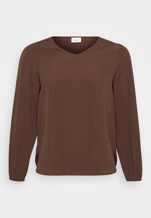 Braunes Langarmoberteil mit V-Ausschnitt und gerafften Ärmeln, präsentiert vor einem schlichten weißen Hintergrund.