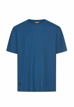Blue short-sleeve crew neck t-shirt with small logo on chest and a label near the bottom hem on a white background.
