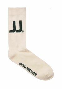 Hvid bomuldsstrømpe med ribbet tekstur, der har et grønt "JJ" logo på oversiden og "JACK & JONES 1990" trykt nær tåen.