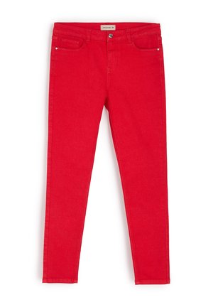 Czerwone dżinsy o slim fit. Z pięcioma kieszeniami, z przodu zapinane na guzik oraz dyskretnymi detalami przeszyci wzdłuż szwów.