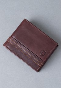 Brown leather wallet with a smooth texture, featuring contrasting yellow stitching and a small embossed logo on the front. Folded design.