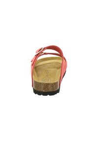 Red leather sandal with two adjustable straps, cork footbed, black rubber sole, and silver buckle detailing on the strap.