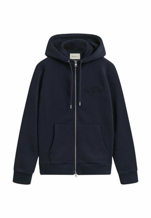Felpa con zip di colore blu navy, realizzata in un tessuto morbido, dotata di cappuccio con cordino, tasche frontali e logo ricamato tono su tono sul petto.