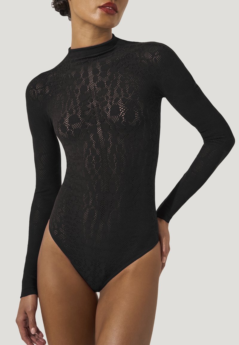 Svart långärmad bodysuit med en figurnära design, som har en mönstrad mesh-textur och hög halsringning. Framhäver kroppens form.