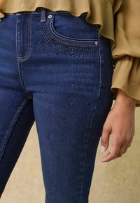 Next SUPER SOFT PETITE - Vaqueros bootcut - blue embellished