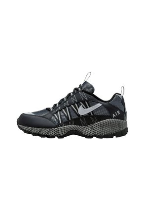 Nike sneakers featuring a black and gray color scheme, mesh and synthetic materials, textured sole, prominent lacing, and logo details.