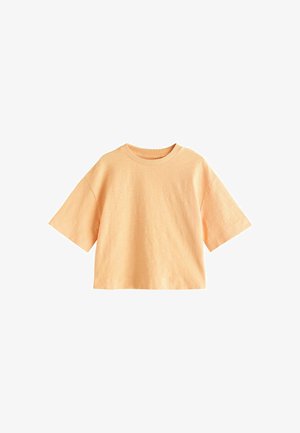 Korte mouwen, lichtoranje cropped T-shirt met ronde hals en losse pasvorm, weergegeven op een witte achtergrond.