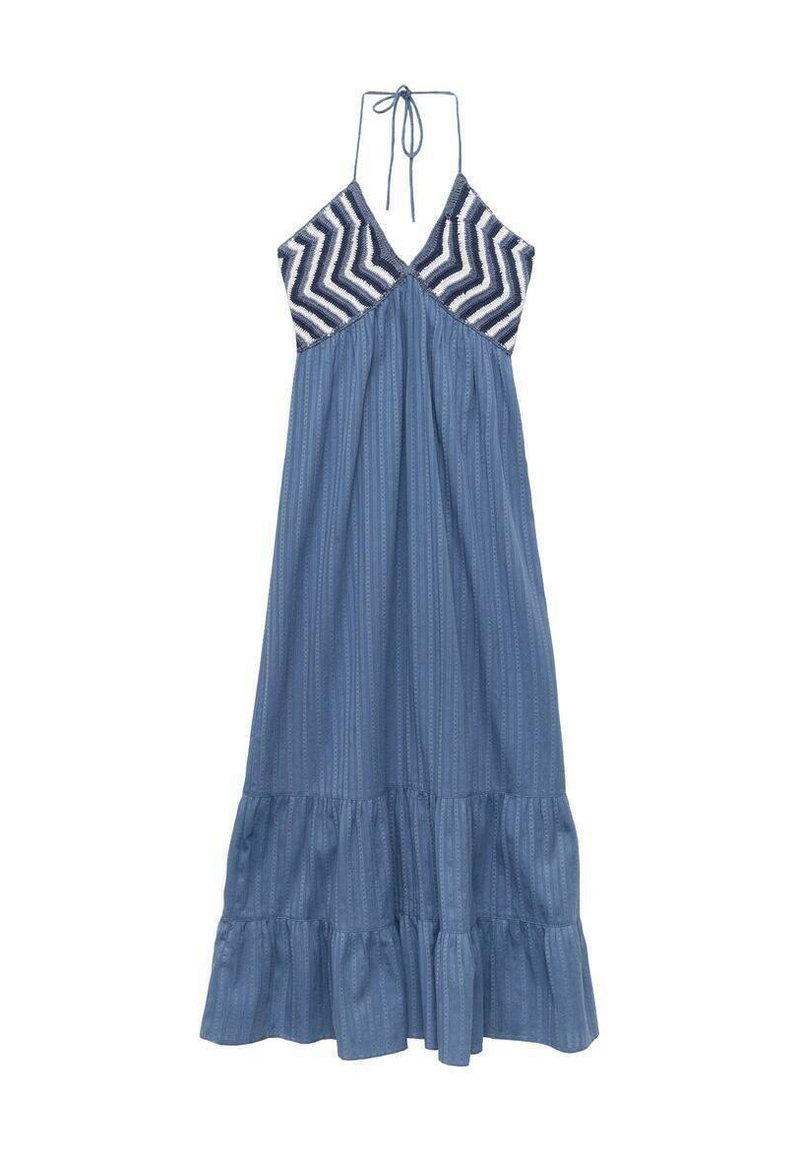 Maxi dress with a halter neck. Top features a chevron pattern in navy and white, while the skirt is solid blue with vertical stripes and ruffles.