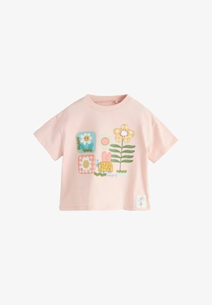 Hele roosa lühikeste varrukatega t-särk, millel on värvikirevad plaastritööst lilled ja ees naeratava lepatriinu kujutis.