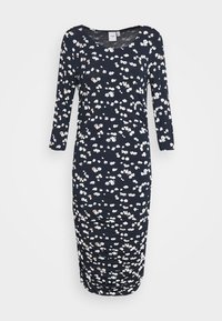 Marinblå blommig klänning i mjukt tyg, med rundad halsringning, långa ärmar och rynkade detaljer längs sidorna.