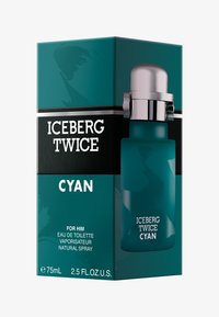 Cyan flaska med Iceberg Twice parfym i en teal-färgad box, försedd med silverdetaljer, fet vit text och en minimalistisk design. Storlek 75 mL.