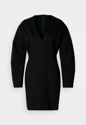 Vestito nero con scollo a V, maniche lunghe e vestibilità aderente. Caratterizzato da dettagli cuciti e chiusura con zip sul retro. Texture morbida e liscia.