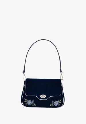 Tumesinine sametist käekott valge äärise ja lillemotiiiviga. Omab kaarduvat klappi ja hõbedast riistu. Reguleeritav õlavarre rihm.