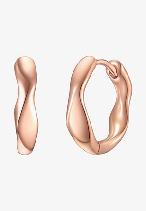 Naušnice od ružičastog zlata s apstraktnim, valovitim dizajnom. Jedna je tanka, izdužena forma, dok je druga debela kružna naušnica s glatkom površinom.