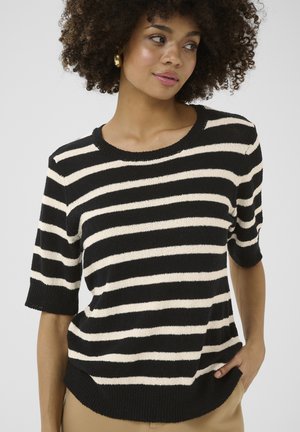Pull en tricot à rayures noires et crème avec des manches courtes et un col rond. Tissu texturé avec une coupe décontractée. L'ourlet présente une légère courbe.