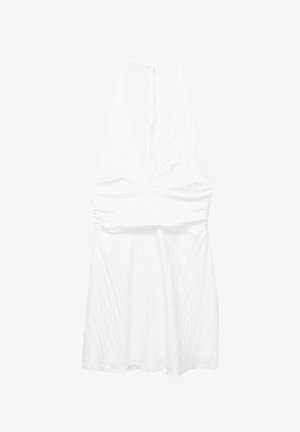 Robe halter blanche en tissu texturé, avec un décolleté en V profond et un lien ajustable au dos. Jupe évasée.