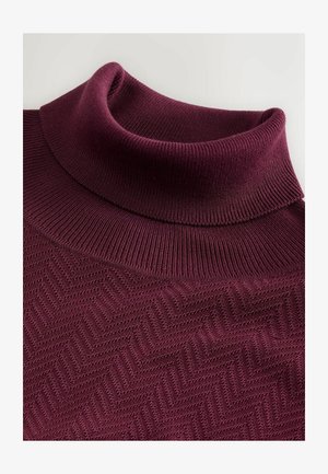 Maglione a collo alto borgogna con texture a costine e motivo a zigzag. Materiale in maglia morbida, con colletto alto e ripiegato.