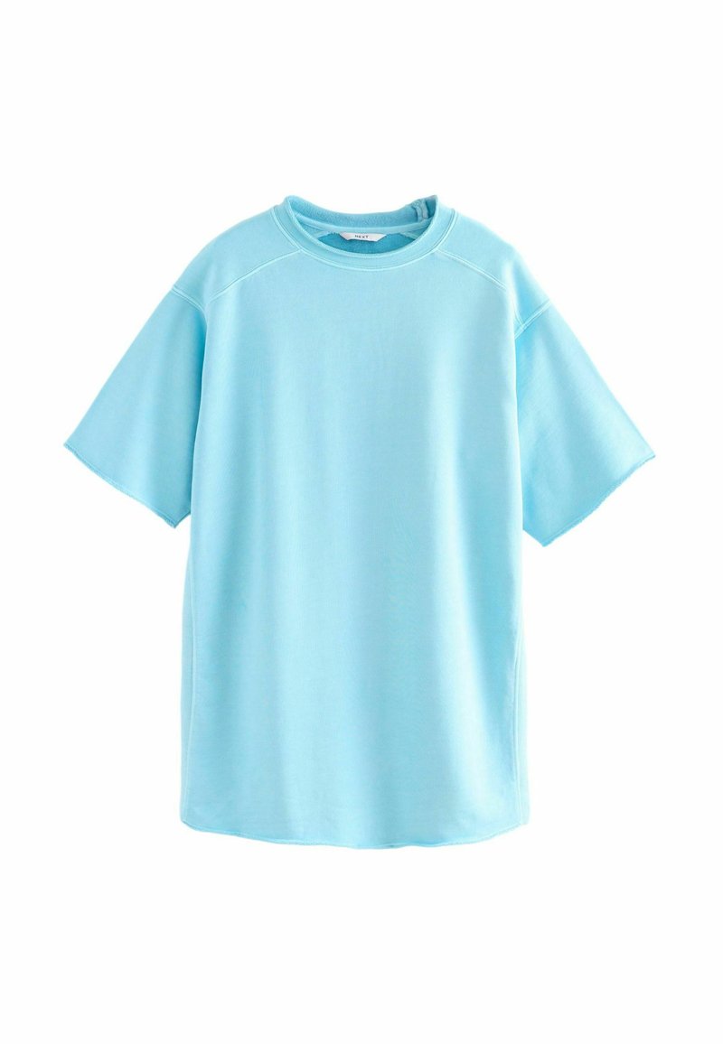 Ljusblå oversized t-shirt med korta ärmar och rund halsringning. Tillverkad av mjukt tyg med en slät textur och rak fåll.