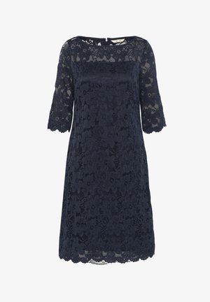 Lace dress in navy blue with short sleeves, floral pattern, scalloped hem, and a straight cut, featuring a back zipper closure.