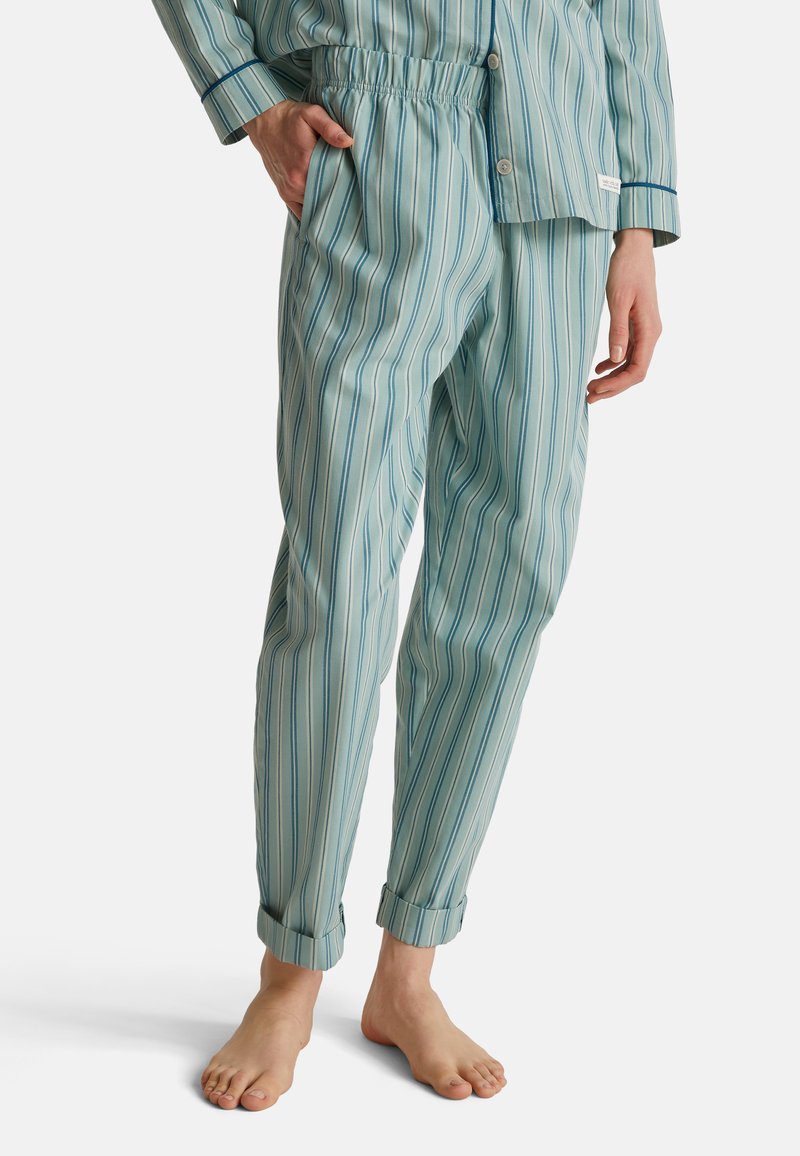 Lichtblauwe pyjamabroek in een verticaal gestreept patroon, met een elastische tailleband, taps toelopende vorm en opgerolde manchetten. Glad textuur.