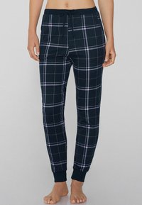 Marineblauwe geruite loungebroek gemaakt van zacht materiaal, met roze en witte lijnen, elastische tailleband met trekkoord en aangesloten manchetten.