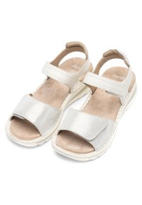 White open-toe sandals with adjustable Velcro straps and cushioned beige insoles designed for comfort and support.