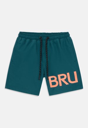 A pair of teal swim shorts with an elastic waistband, black drawstring, and large coral "BRU" logo on the left thigh.