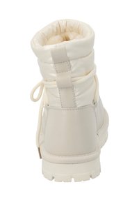 Stivaletti color crema con tomaia imbottita, punta rotonda e suola in gomma testurizzata. Presentano lacci e un'etichetta sul retro per una facile calzata.