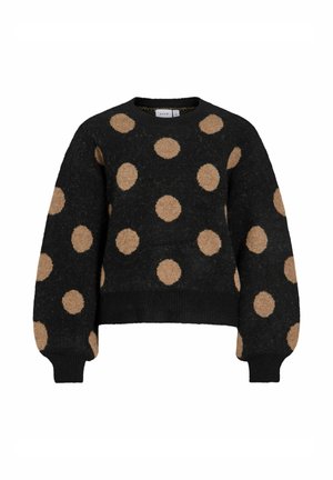 Svart tröja med stora beige polka dots, rund halsringning och ribbade muddar. Tillverkad av texturerat stickat tyg med en kort design.