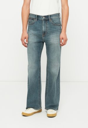 STUDS AND FLAPS - Bootcut-teksad - blue denim