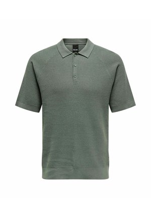 Short-sleeve polo in muted green, featuring a textured knit, two-button placket, and ribbed collar and hem.