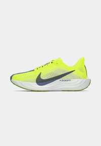 Neon yellow running shoe with a breathable mesh upper, gray accents, and a cushioned white sole. Features Nike branding and Zoom technology.
