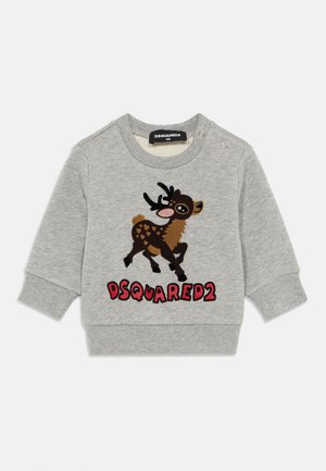 Gray sweatshirt featuring a cartoon deer graphic with brown accents and black antlers. "DSQUARED2" text in red at the bottom. Snap button on shoulder.