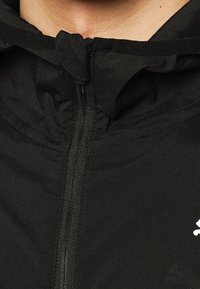 Puma Laufjacke - black