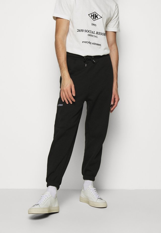 PANTS - Verryttelyhousut - black