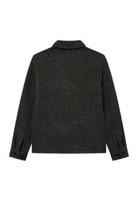 Melnās herringbone raksta jakas ar apkakli, garām piedurknēm un pogām pie aprocēm. Tekstūrēta auduma ar smalkiem krāsu pleķiem.