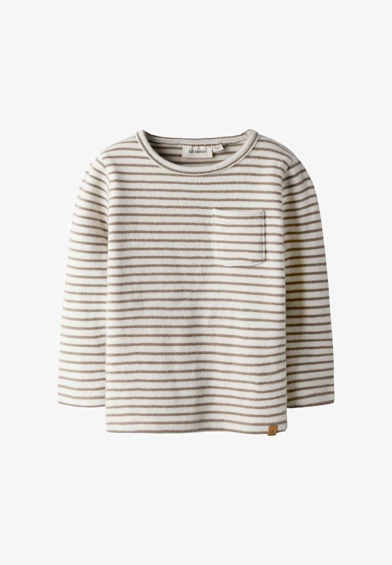 Hosszú ujjú, krémszínű csíkos felső világosbarna csíkokkal. Mellzsebe van, és puha, textúrált anyagból készült. Kerek nyakkivágású.