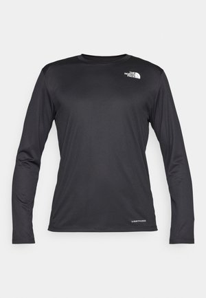 Čierna košeľa s dlhým rukávom vyrobená z ľahkej, vlhkosť odvádzajúcej tkaniny. Obsahuje okrúhly výstrih a logo na ľavej strane hrude.