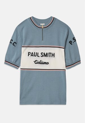 Short-sleeved blue sweater with a white horizontal band. Features "PAUL SMITH" and "Ciclismo" in black text, with pink and black stripes at edges.