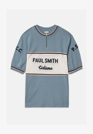 Suéter azul de manga corta con una franja horizontal blanca. Presenta "PAUL SMITH" y "Ciclismo" en texto negro, con rayas rosa y negras en los bordes.