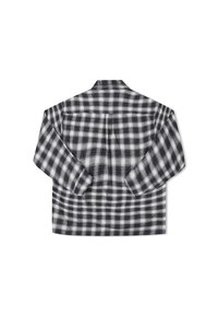 Black and white plaid shirt jacket, made from soft flannel, featuring a loose fit, long sleeves, and a classic collar.