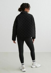 aim’n® QUILTED FEMME - Light jacket - black
