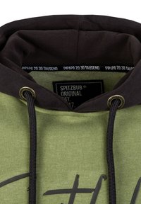 Green hoodie with a dark brown hood, featuring a drawstring and a black logo tag inside. The fabric has a soft texture, and it includes a printed design.