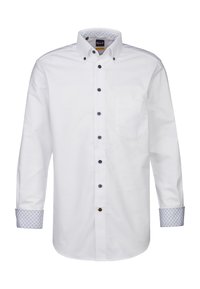 Camicia bianca a maniche lunghe con colletto alla francese, bottoni blu navy e dettagli a motivo blu sui polsini e all'interno del colletto. Caratterizzata da una tasca sul petto.
