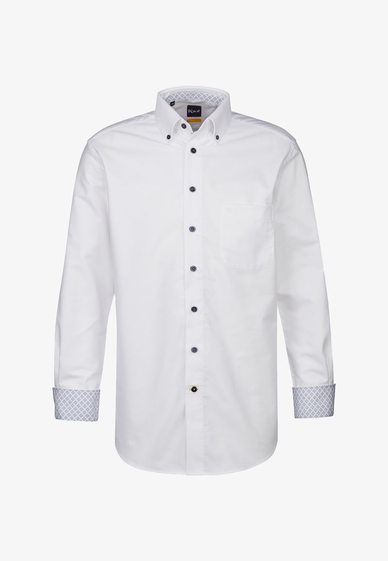 Camicia bianca a maniche lunghe con colletto alla francese, bottoni blu navy e dettagli a motivo blu sui polsini e all'interno del colletto. Caratterizzata da una tasca sul petto.