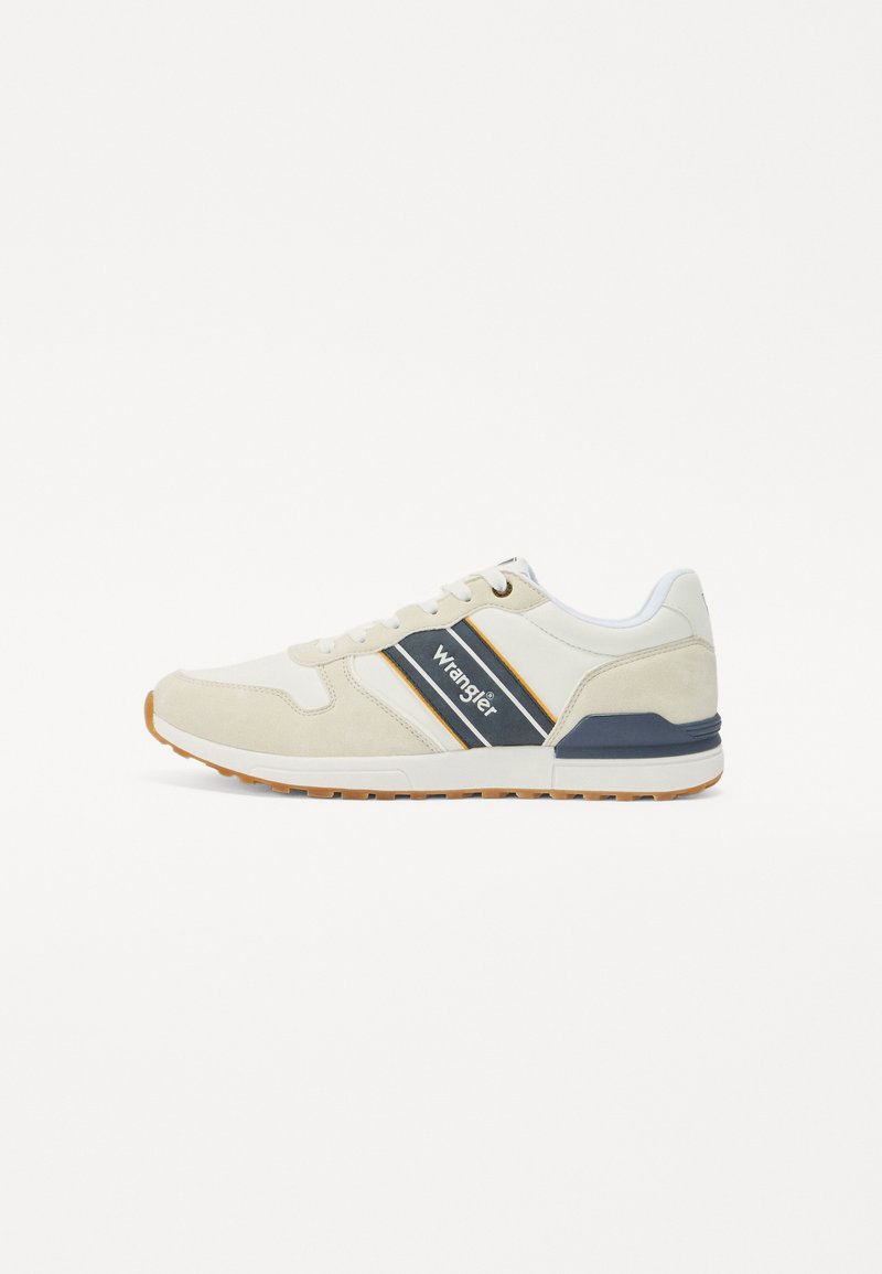 Beige velúr és hálós sneaker fehér kiegészítőkkel és tengerészkék csíkkal. Gumi talp narancssárga díszítéssel, a Wrangler logójával.