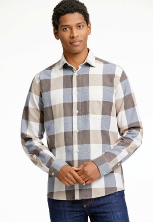Camisa de cuadros con botones en tonos marrón, crema y azul. Confeccionada en una tela texturizada y con un único bolsillo en el pecho.